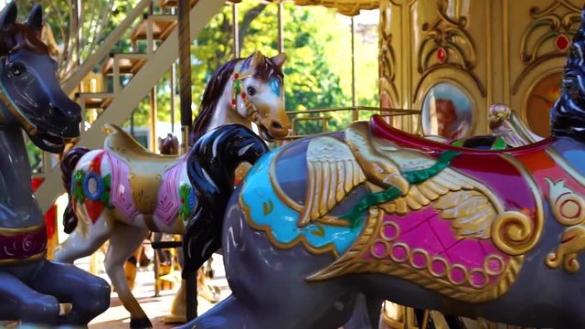 Amazing close up view on vintage circus carousel retro merry go round horse ride attraction at amusement park carnival