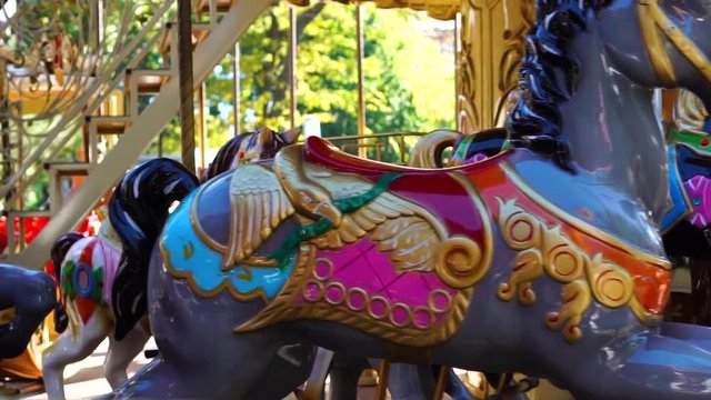 Incredible close up view on vintage circus carousel retro merry go round horse ride kids attraction spinning at carnival