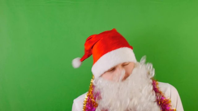 Crazy Man wearing Santa Claus's hat with white beard, New year 2019 and christmas, on green Chroma key