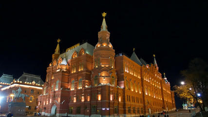 Architectural details of building near Red Square in Moscow illuminated at night.