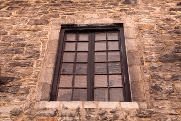 old window in stone wall