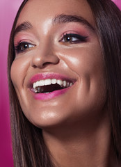 Close up happy beauty woman portrait. Fashion shiny skin, with drops sexy gloss lips make-up and pink eyeshadows