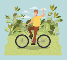 young man in bicycle on park