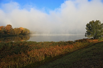 Fototapeta premium sunset on the river fog