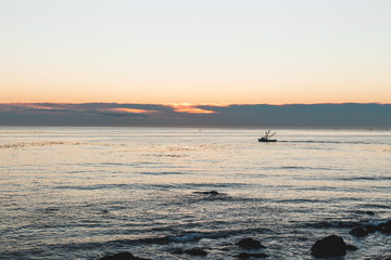 fishing boat at sunrise