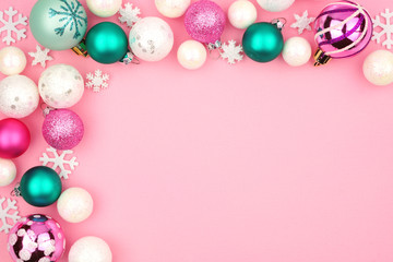 Naklejka na ściany i meble Modern pastel Christmas bauble corner border over a light pink background