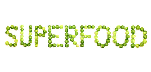 The word superfood is spelled out with brussel sprouts on a white Image and could be used to get across message of healthy eating, especially of green vegetables