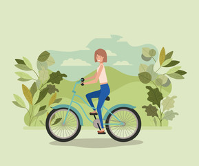 Naklejka premium young woman in bicycle on park