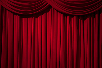 Large red curtain stage, with spot lights and dark background