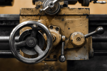 background - detail of an old manual metalworking turning lathe