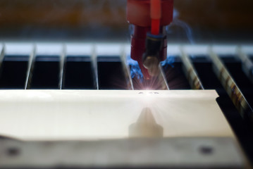 stage of manufacturing, laser engraving in automatic mode, close-up, blurred background