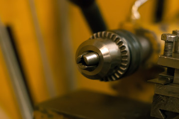 detail of the lathe - clamping chuck - close up on a blurred background