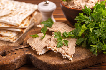 Homemade chicken liver pate with matzo and parsley