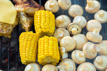BBQ Meat with cheese, Champignon mushrooms and corn grilled on grill