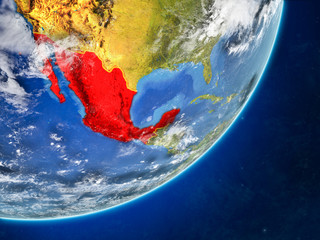 Mexico on model of planet Earth with country borders and very detailed planet surface and clouds.