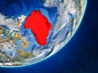 Greenland on model of planet Earth with country borders and very detailed planet surface and clouds.