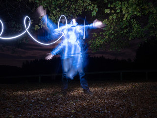 Ghost Man at forest with light game in blue