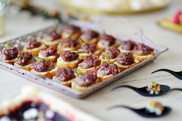 Delicious pate snacks with beet topping served on a party or wedding reception.