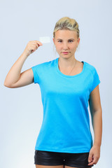 Fototapeta premium Young blonde girl holds business card