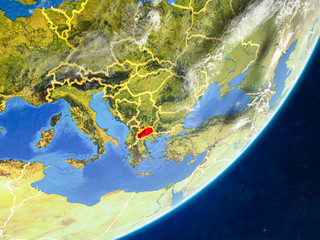 Macedonia on model of planet Earth with country borders and very detailed planet surface and clouds.