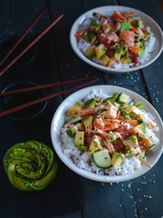 California roll sushi bowls on dark background 