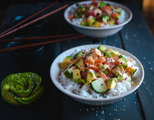 California roll sushi bowls on dark background 