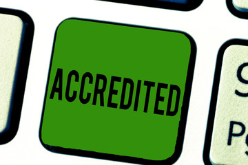 Handwriting text Accredited. Concept meaning Having credits authority to something Certified...