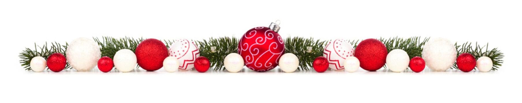 Long Christmas border of red and white ornaments and branches isolated on a white background