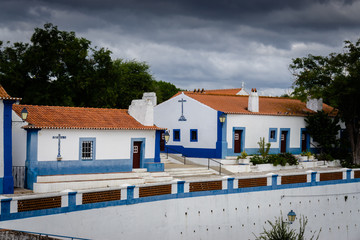 Typical whitewashed terraced cottages in the picturesque historic village of Coruche. Santarem,...