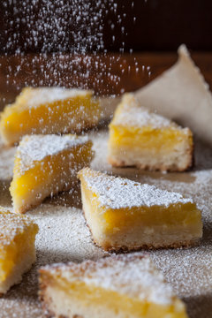 Powdered sugar falling on lemon pie