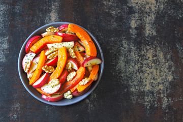 Autumn salad with pumpkin and apple. Healthy vegan pumpkin apple salad.