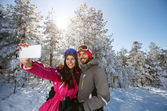 Couple on winter taking photo outdoor