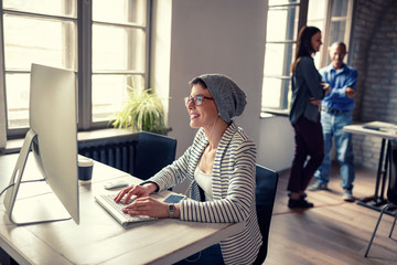 Woman work on computer in company