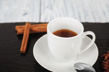 hot coffe on black slate square stone