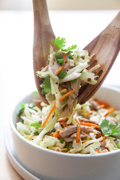 Asian Cabbage Salad With Chicken In White Bowl