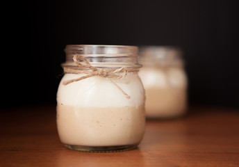 Delicious Dessert in a glass jar on a black background