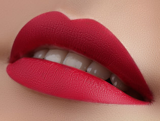 Beautiful Woman Lips with Fashion Lipstick Makeup. Cosmetic, Fashion Make-Up Concept. Beauty Lip...