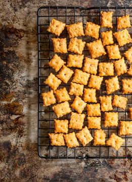 Homemade cheese crackers cooling on rack