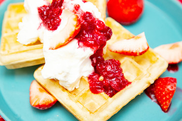 Strawberry waffle with cranberries sauce