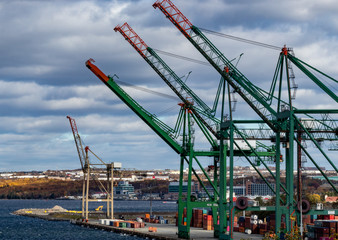 cranes in the port Halifax, cloudy sky.