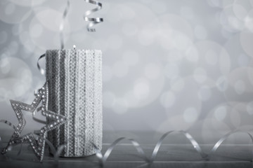 Silver Christmas candle with ribbon