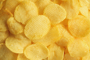 crispy potato chips snack texture background closeup top view