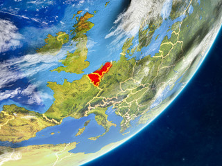 Benelux Union on model of planet Earth with country borders and very detailed planet surface and clouds.