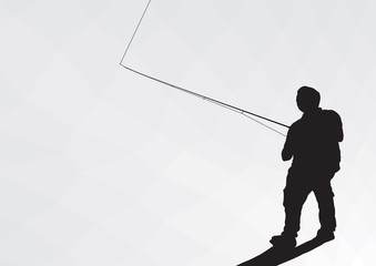 Silhouette of a fisherman with a backpack and spinning. A fisherman catches a fish.