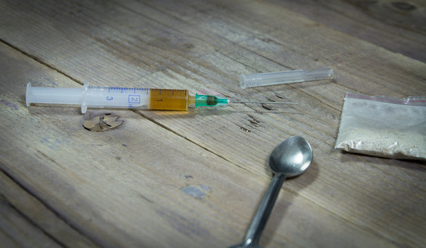 Syringe, spoon and heroin. Crime scene