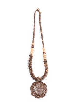 A handmade coconut shell necklace on a white background.
