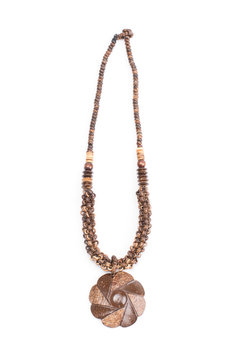 A handmade coconut shell necklace on a white background.