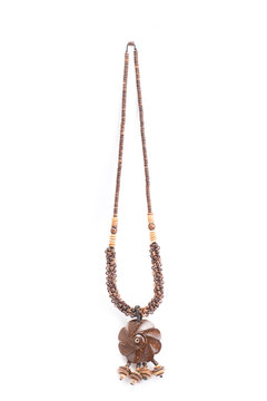 A handmade coconut shell necklace on a white background.