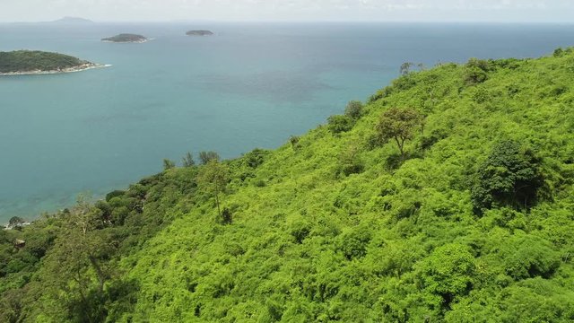 4k aerial view drone shot of beautiful mountain and tropical sea in summer season Location at Laem Krating Phuket Thailand