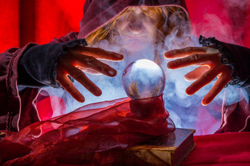 a fortune teller reads from a crystal ball